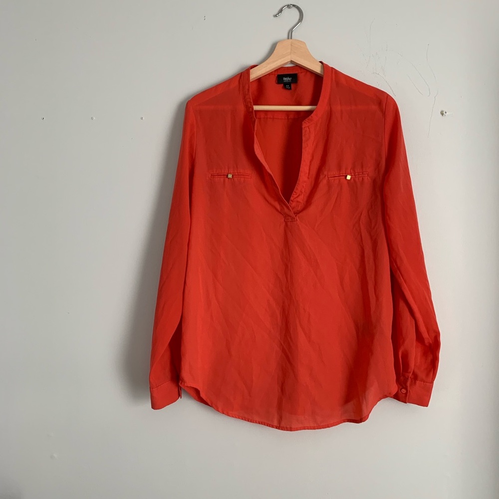 | v-neck reddish orange blouse |